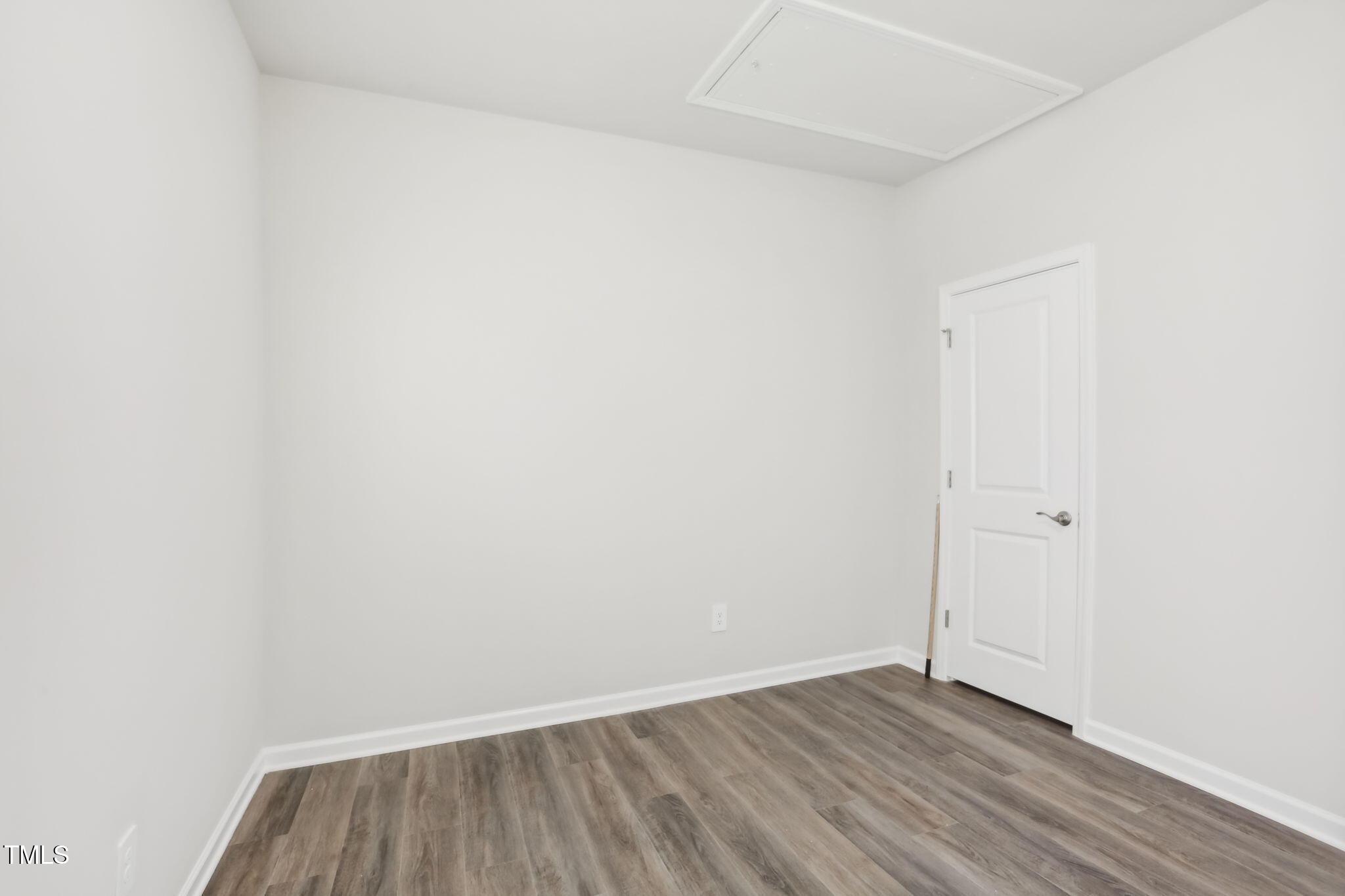185 White Birch Lane Angier, NC 27501 - Photo 18 of 27 a view of an empty room with wooden floor