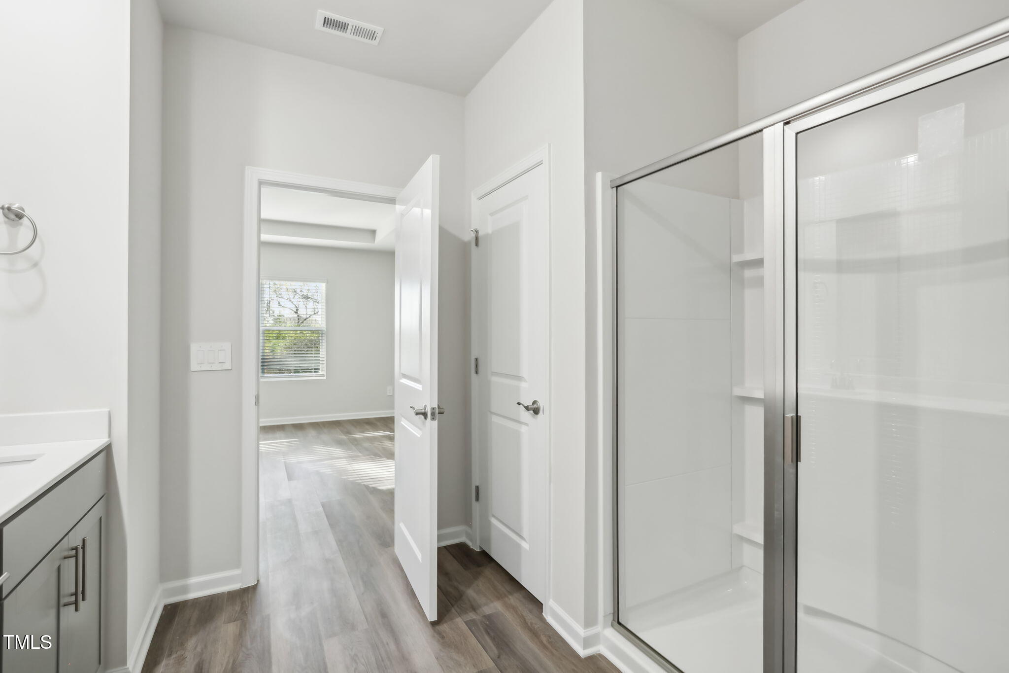 185 White Birch Lane Angier, NC 27501 - Photo 22 of 27 a view of bathroom with a shower and a glass door
