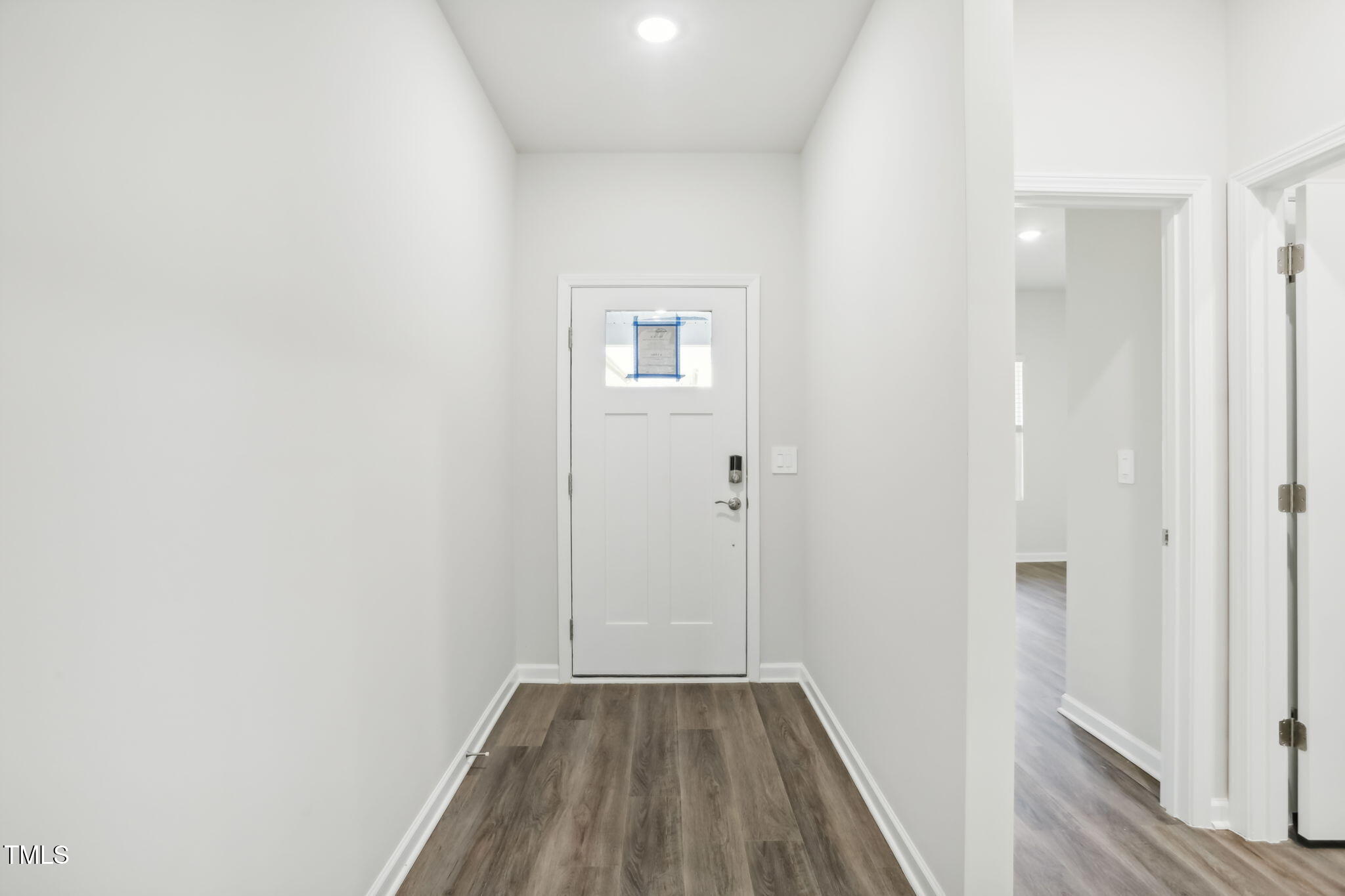 185 White Birch Lane Angier, NC 27501 - Photo 8 of 27 a view of a hallway with wooden floor