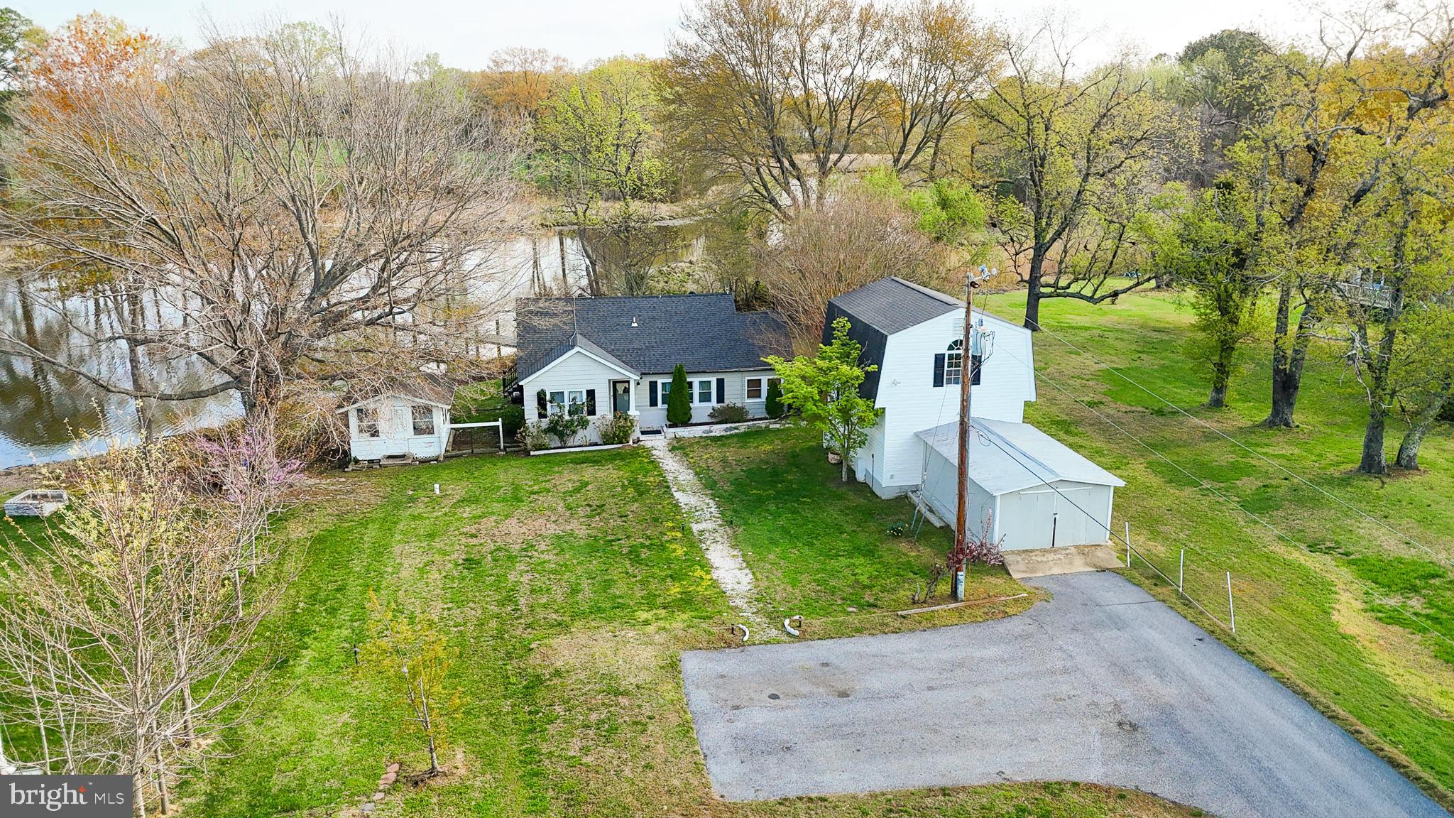 37526 River Springs Road Avenue, MD 20609 - Photo 2 of 61 a front view of a house with garden