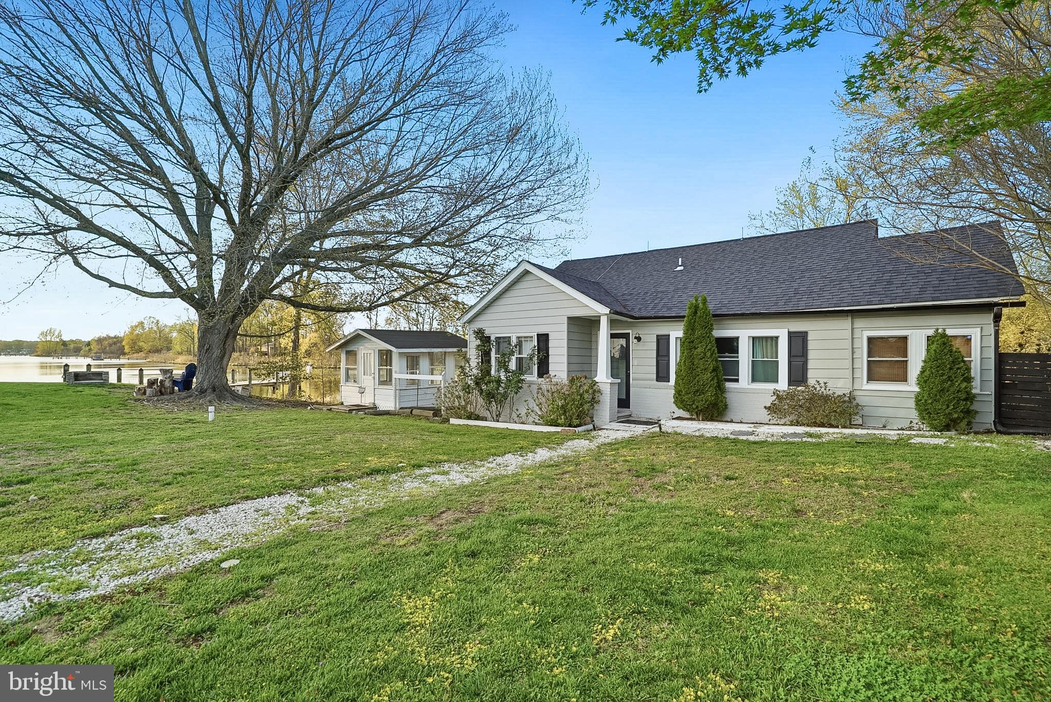 37526 River Springs Road Avenue, MD 20609 - Photo 4 of 61 a front view of a house with a garden
