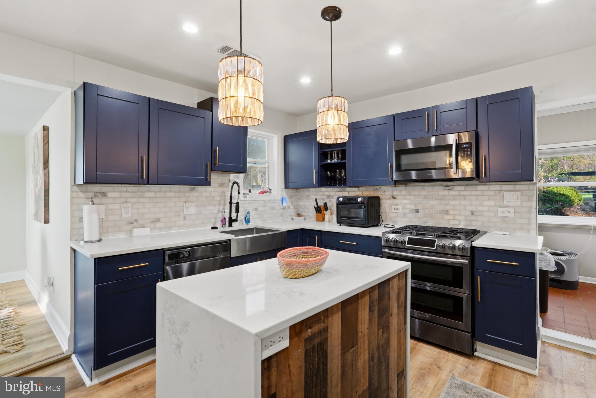 37526 River Springs Road Avenue, MD 20609 - Photo 5 of 61 a kitchen with a sink stainless steel appliances and cabinets