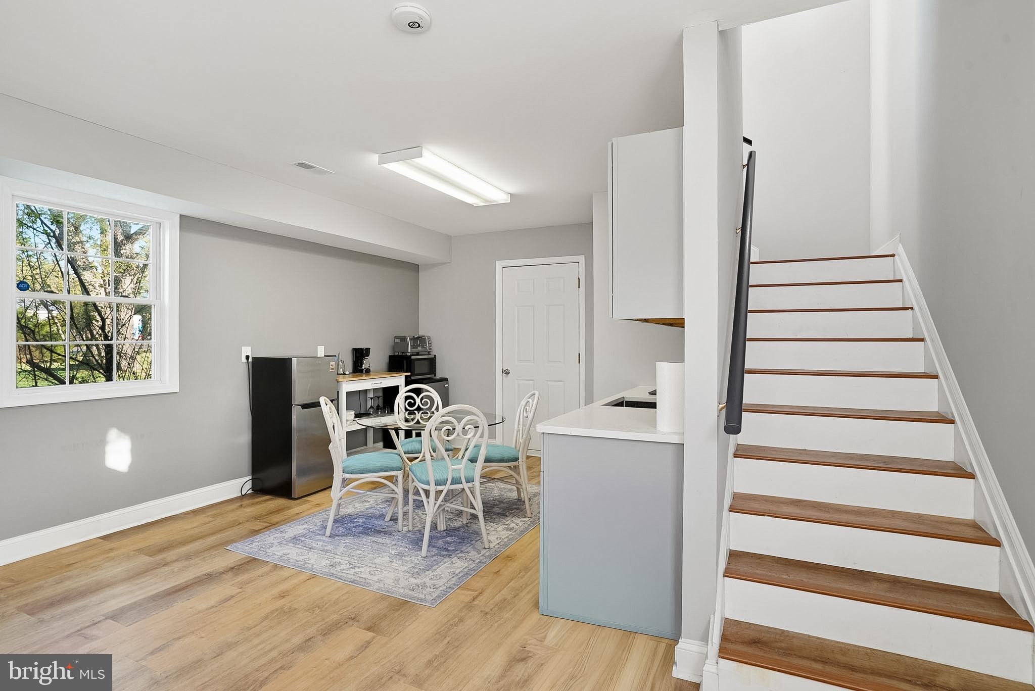 37526 River Springs Road Avenue, MD 20609 - Photo 6 of 61 a living room with furniture and a wooden floor