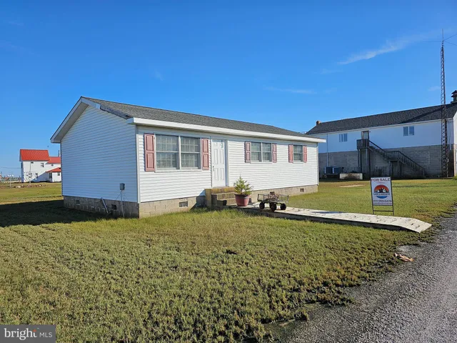 a backyard of a house with barbeque oven