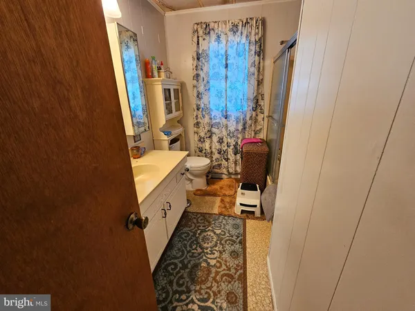 a bathroom with sink and mirror