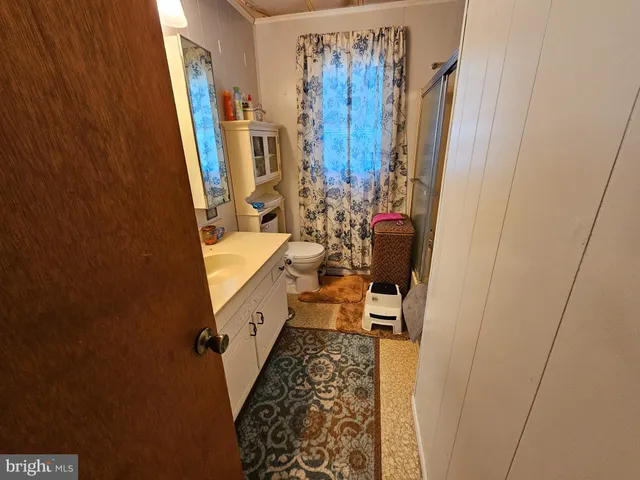 a bathroom with sink and mirror