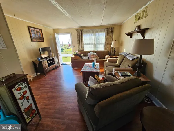 a living room with furniture or couch and a flat screen tv