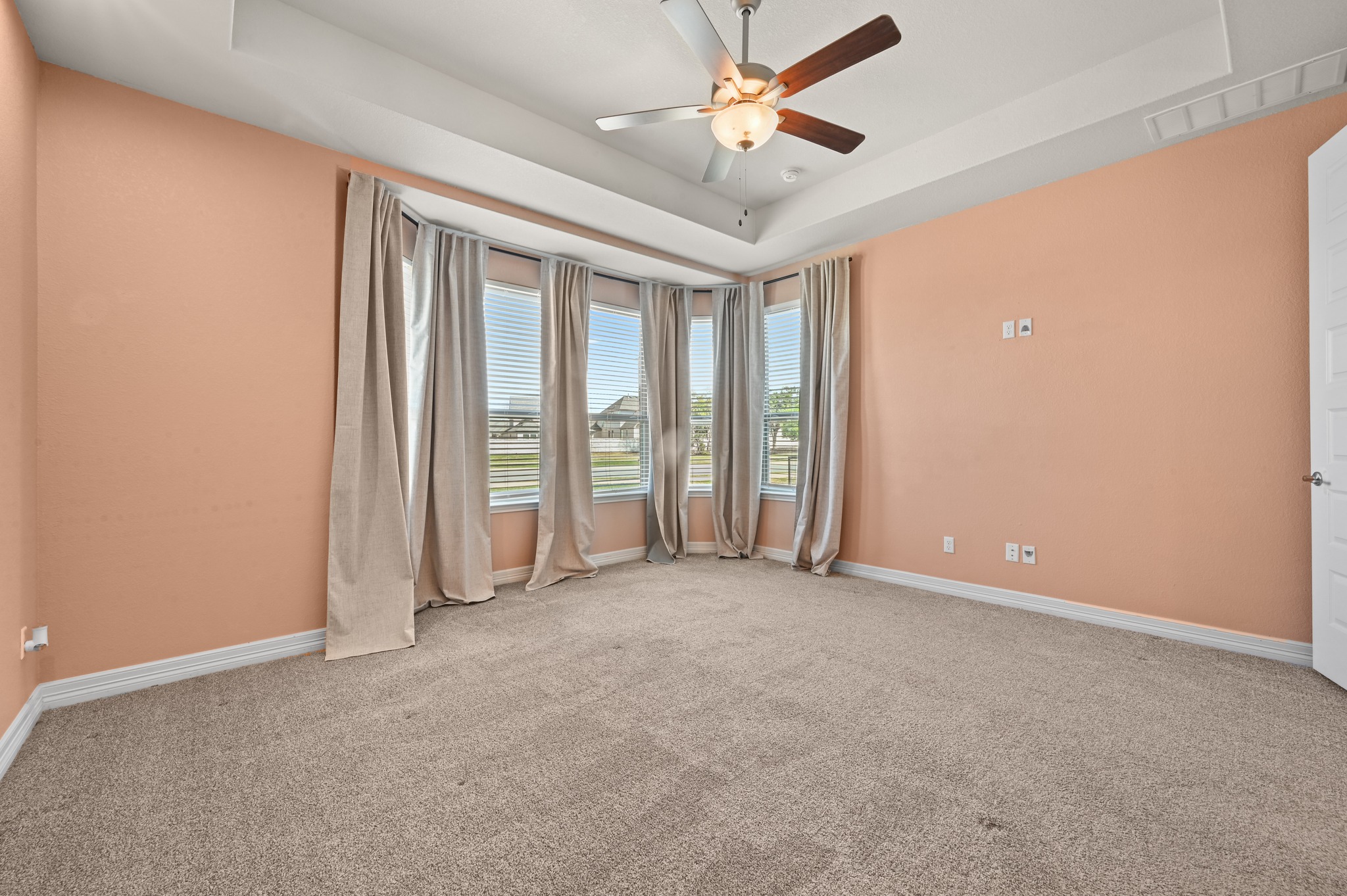 208 West Branch Road Kyle, TX 78640 - Photo 12 of 27 The primary suite sits privately away from the other secondary bedrooms and features it's own ensuite.