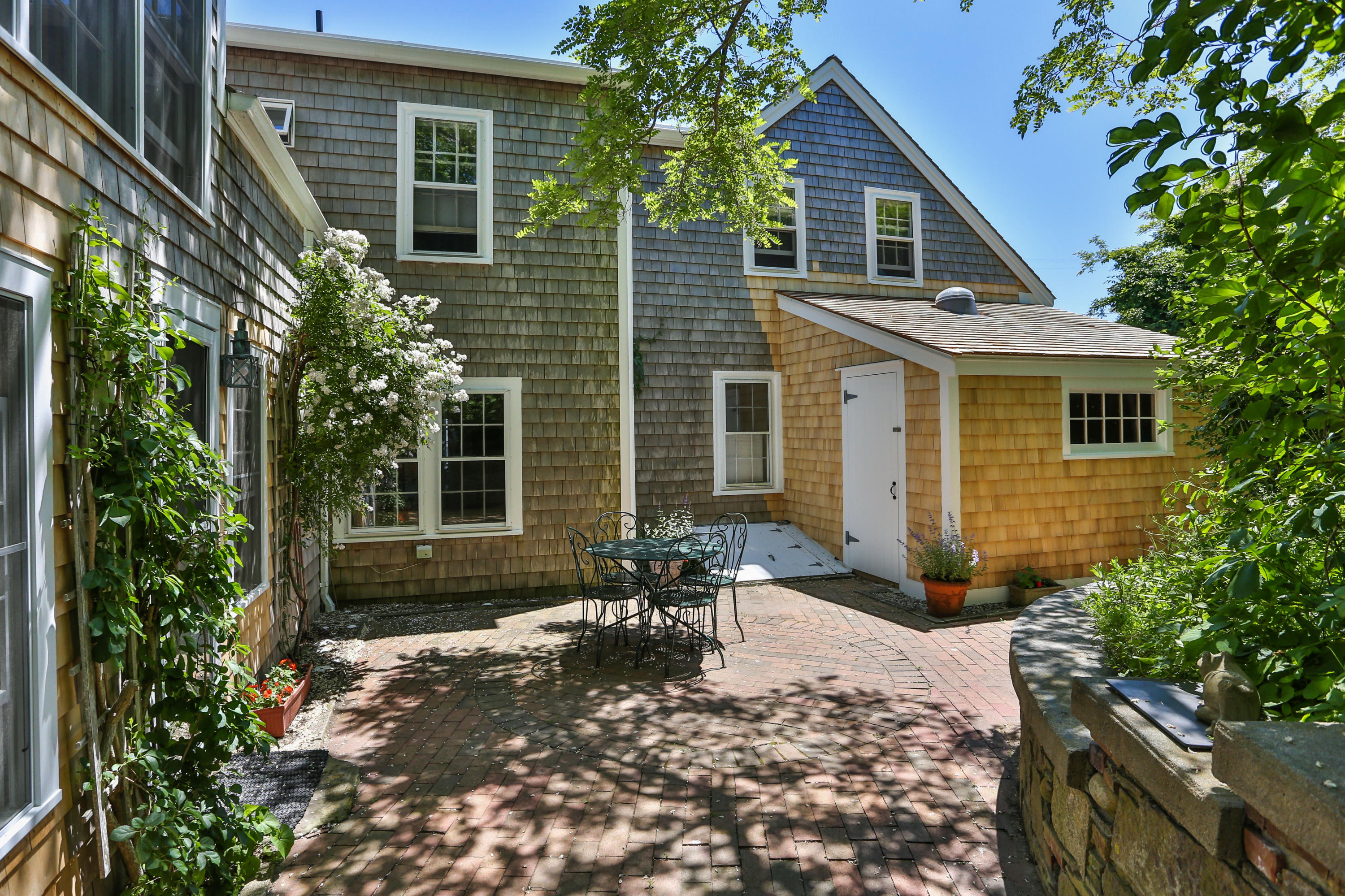 33 Pond Road Truro, MA 02666 - Photo 25 of 28 a backyard of a house with yard and outdoor seating