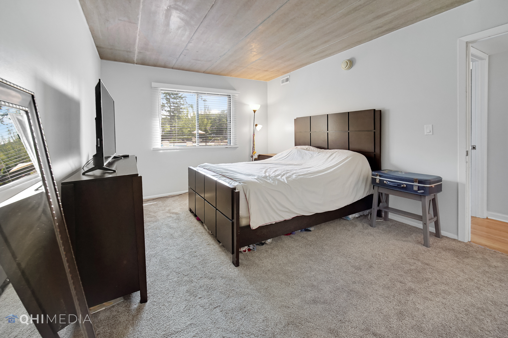 484 Timber Ridge Drive, Unit 106 Carol Stream, IL 60188 - Photo 11 of 23 a bedroom with a bed dresser and a window