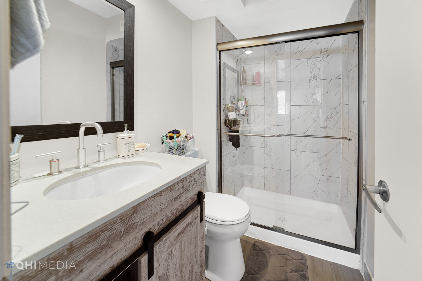 484 Timber Ridge Drive, Unit 106 Carol Stream, IL 60188 - Photo 13 of 23 a bathroom with a granite countertop sink a toilet and shower