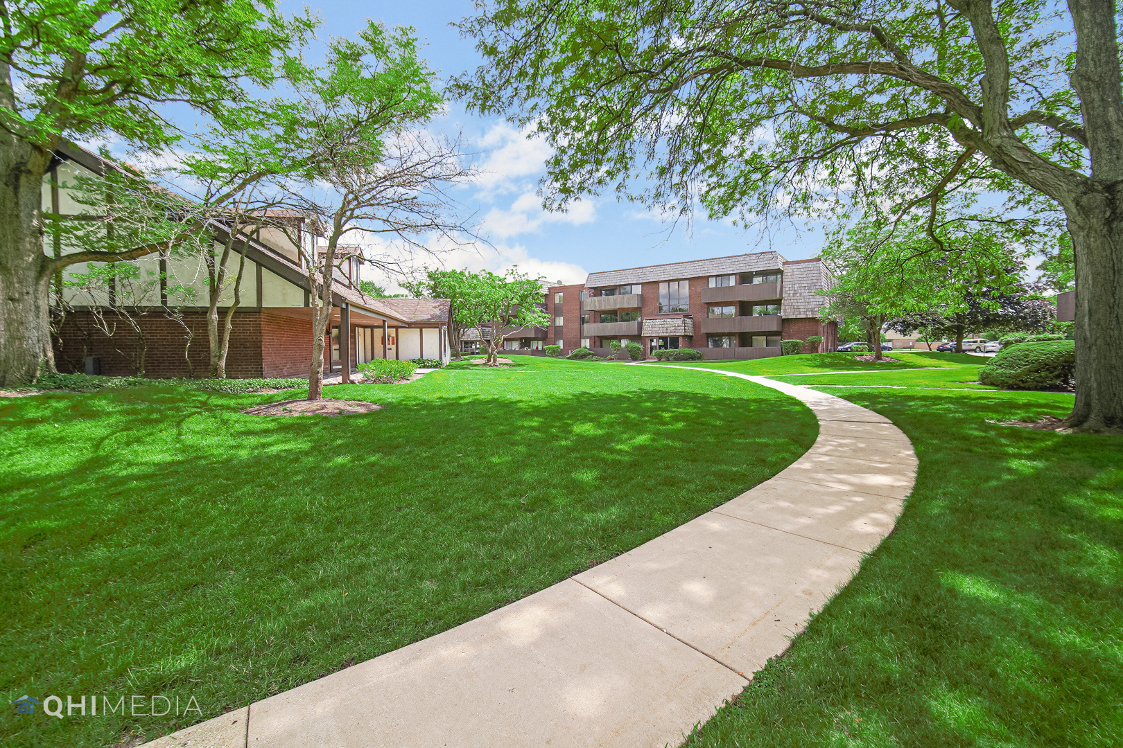 484 Timber Ridge Drive, Unit 106 Carol Stream, IL 60188 - Photo 18 of 23 a view of a house with a yard