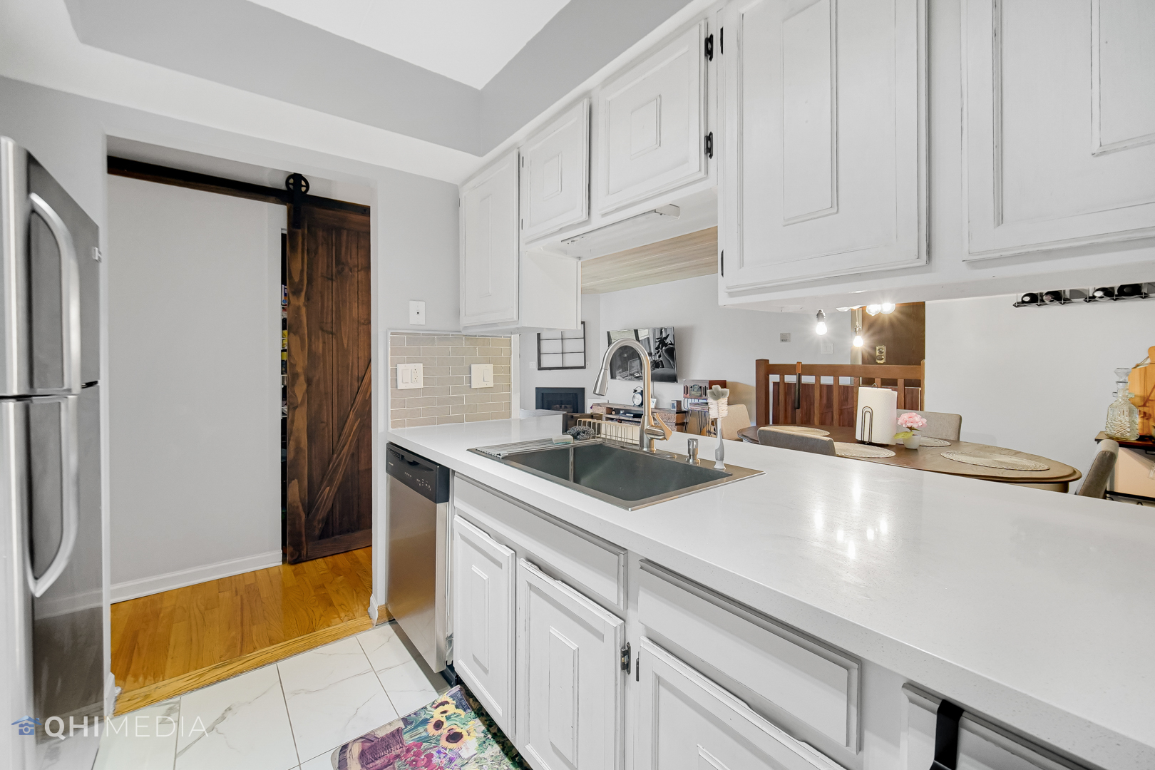 484 Timber Ridge Drive, Unit 106 Carol Stream, IL 60188 - Photo 5 of 23 a kitchen with a sink and cabinets