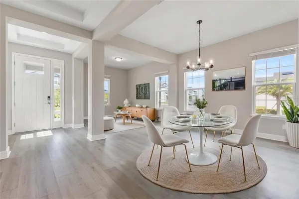 a kitchen with stainless steel appliances kitchen island wooden floors cabinets and wooden floor