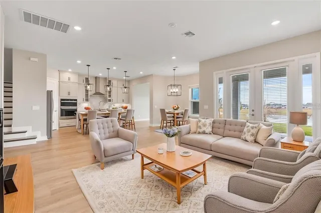 a kitchen with stainless steel appliances granite countertop a sink and stove