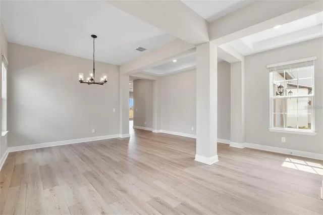 a view of an empty room and closet area