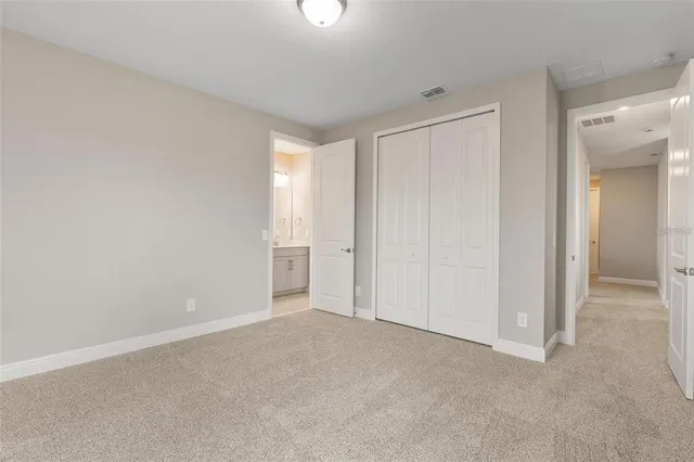 a white bath tub sitting next to a white toilet and a sink