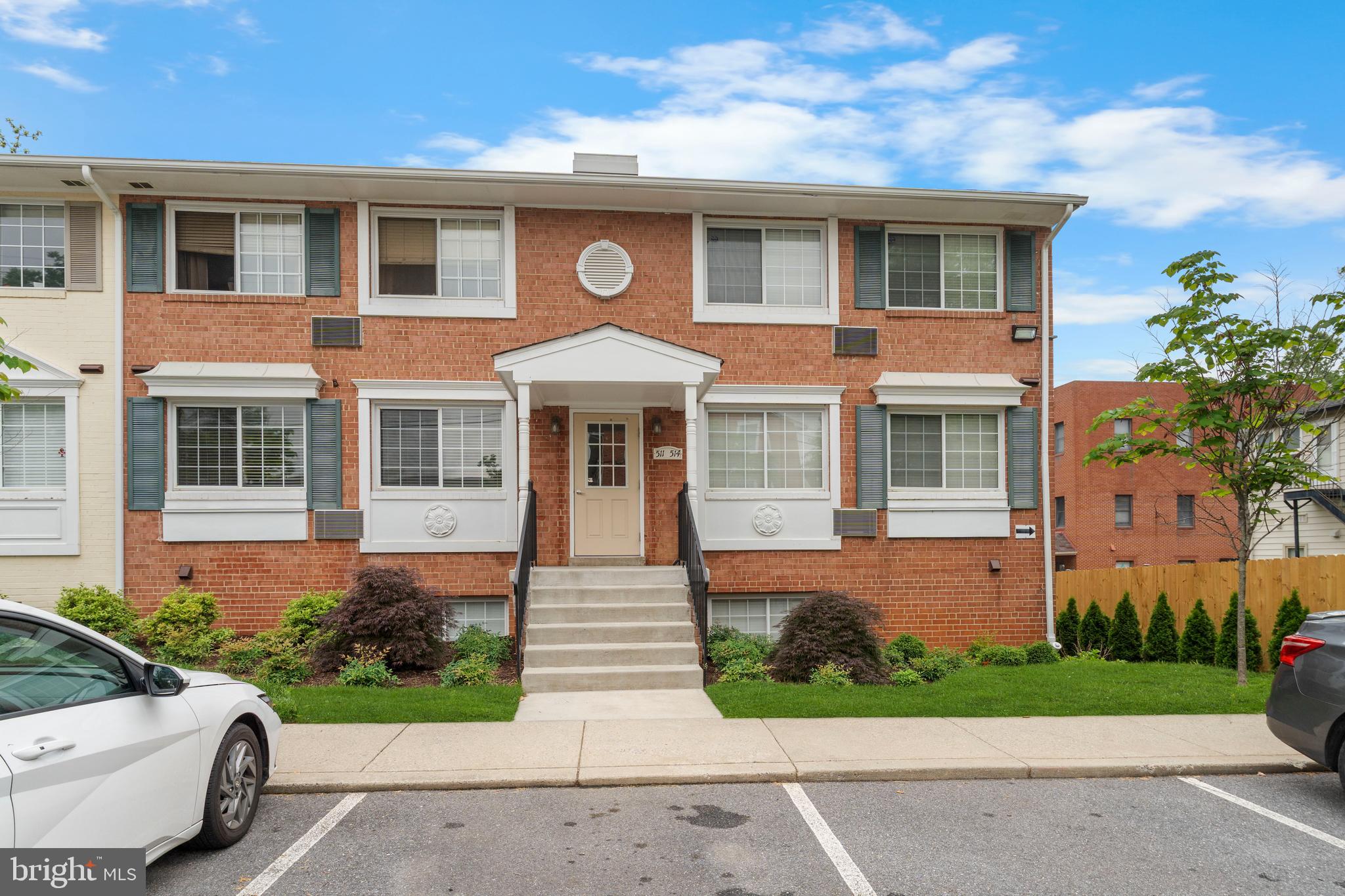 610 Main Street, Unit 511 Laurel, MD 20707 - Photo 1 of 30 a front view of a house with a yard