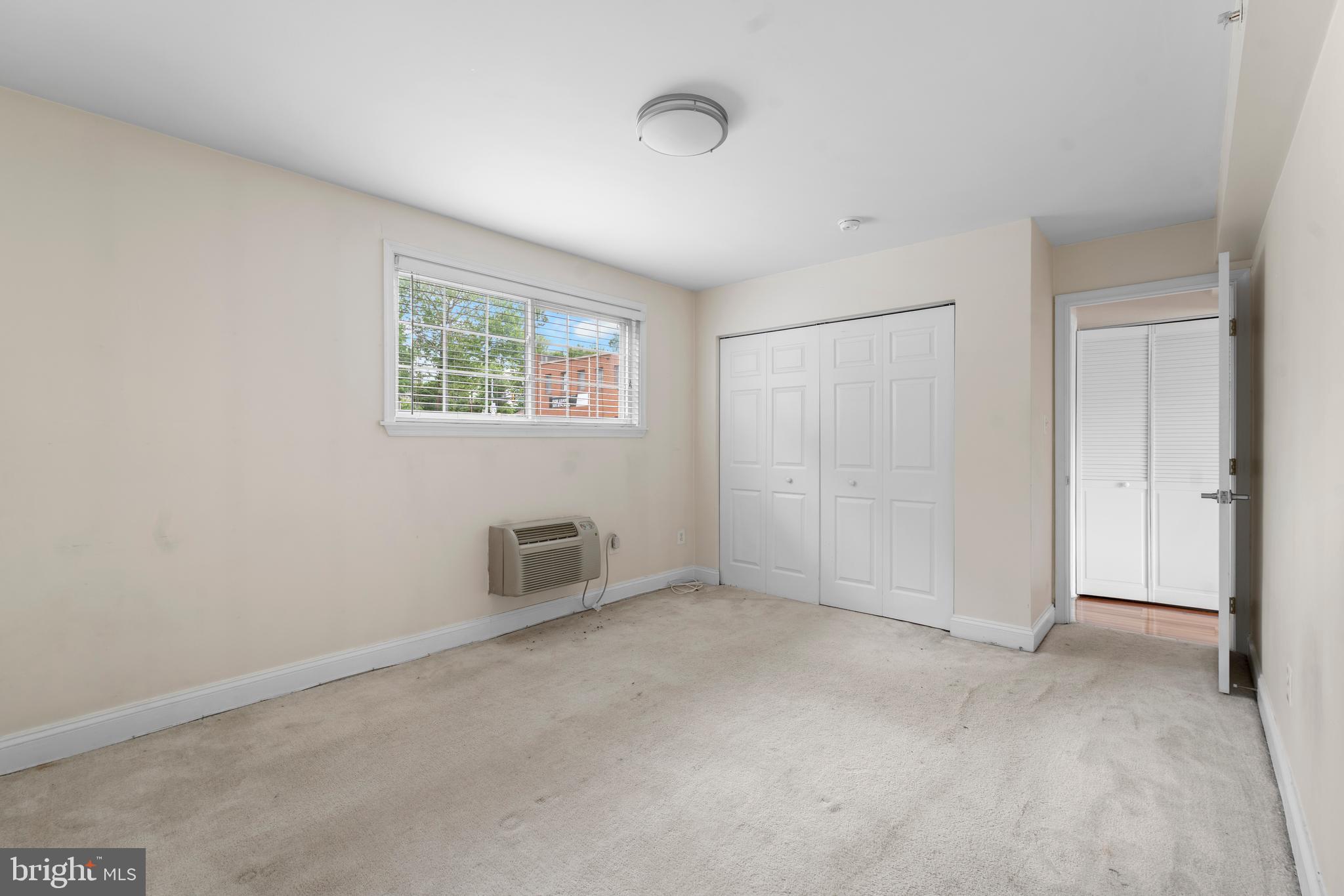 610 Main Street, Unit 511 Laurel, MD 20707 - Photo 18 of 30 an empty room with windows and closet