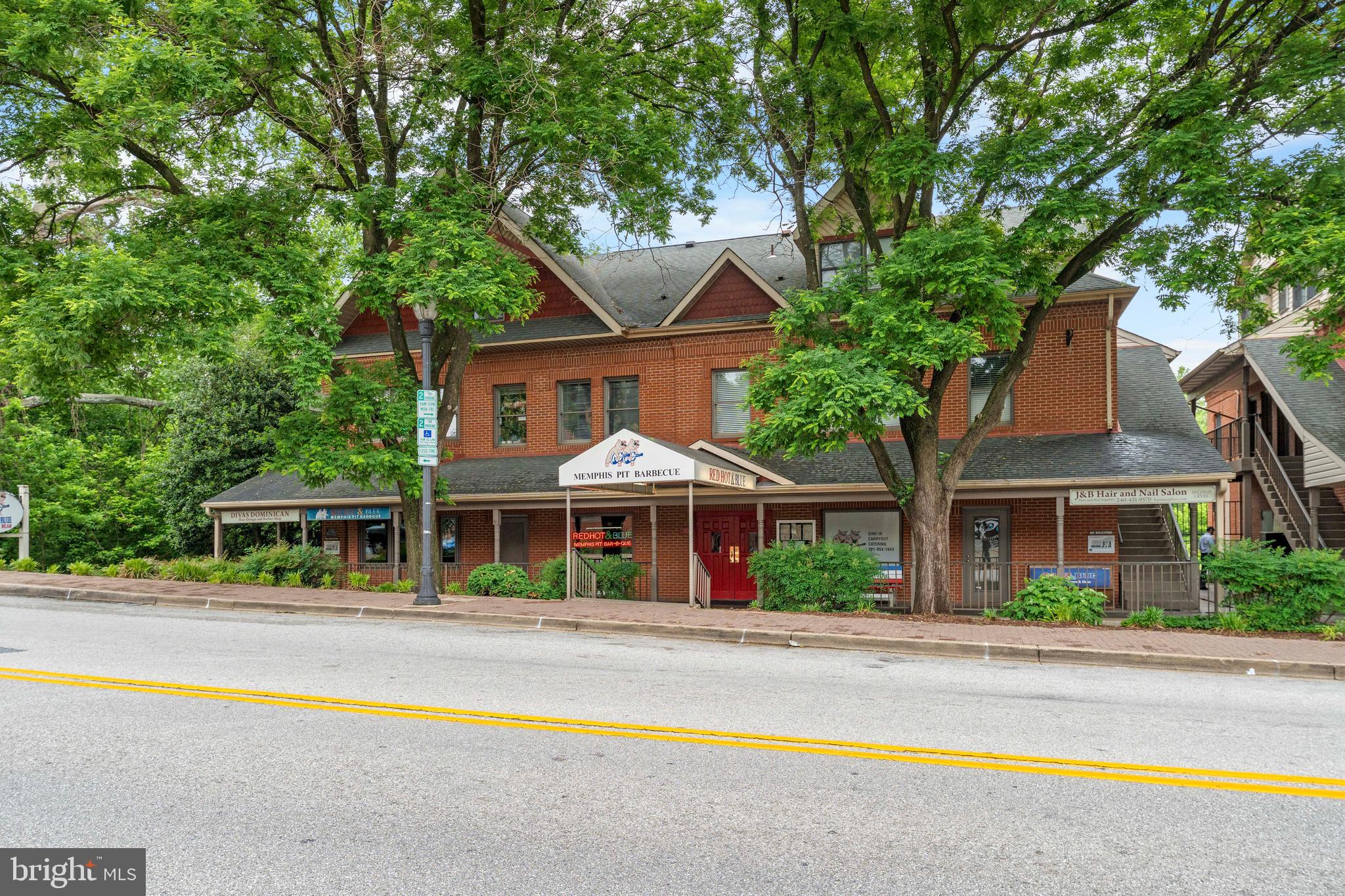 610 Main Street, Unit 511 Laurel, MD 20707 - Photo 20 of 30 a front view of house with yard outdoor seating and barbeque oven