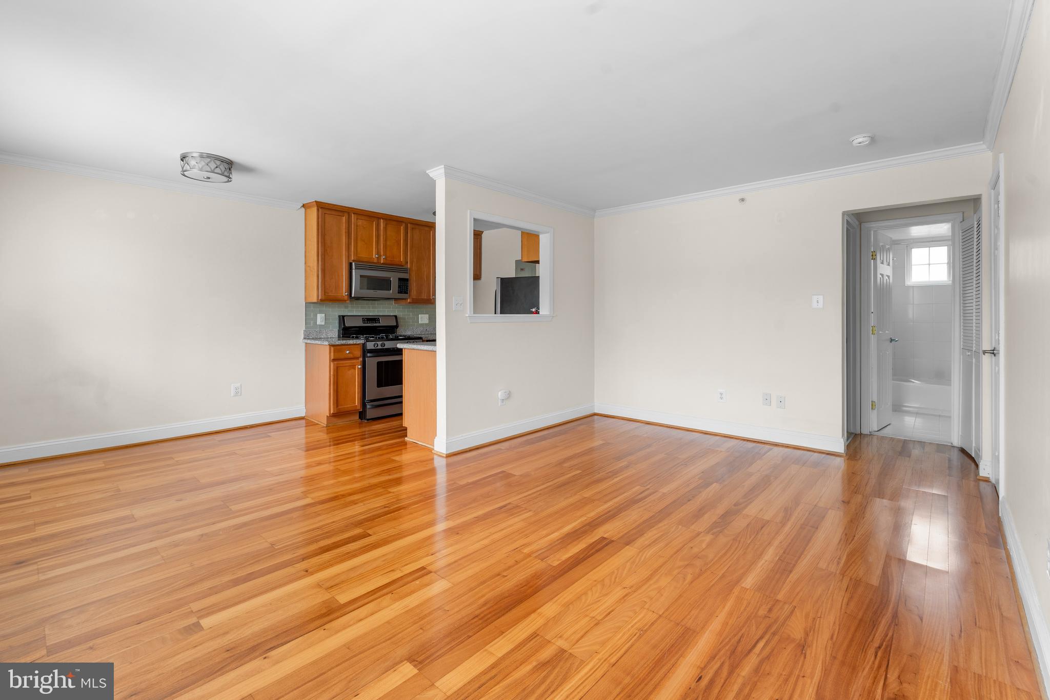 610 Main Street, Unit 511 Laurel, MD 20707 - Photo 5 of 30 a view of empty room with wooden floor