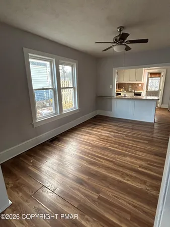 a view of a livingroom with wooden floor