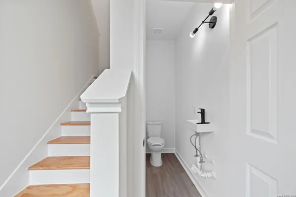 a bathroom with a sink and toilet