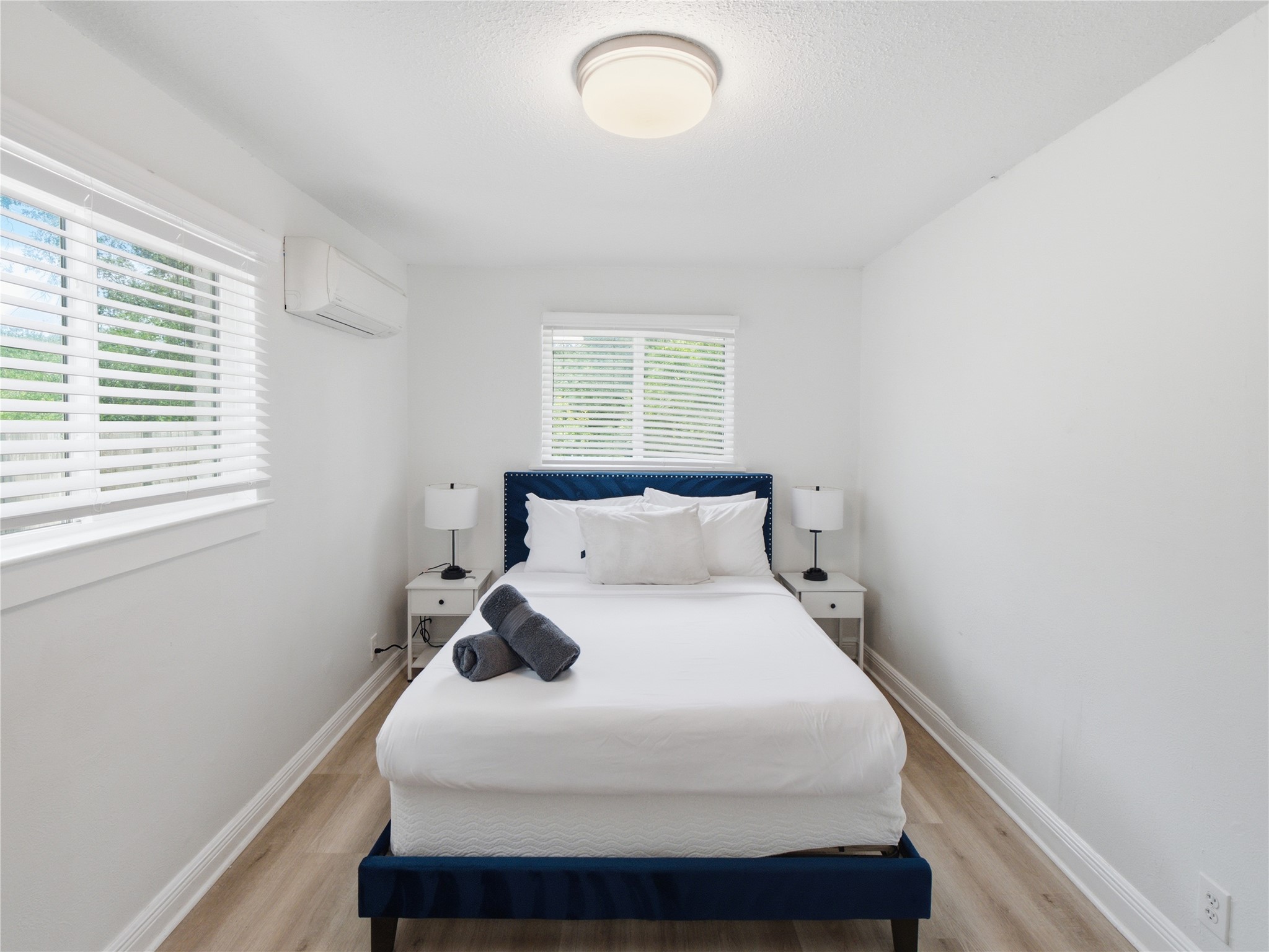 1108 Jolena Circle Austin, TX 78721 - Photo 7 of 21 A tranquil bedroom features light wood flooring and windows that welcome natural light.