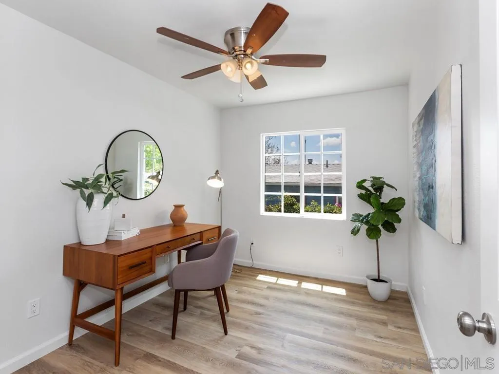 4765 Maple Avenue La Mesa, CA 91942 - Photo 13 of 26 a view of a workspace room with furniture window and wooden floor