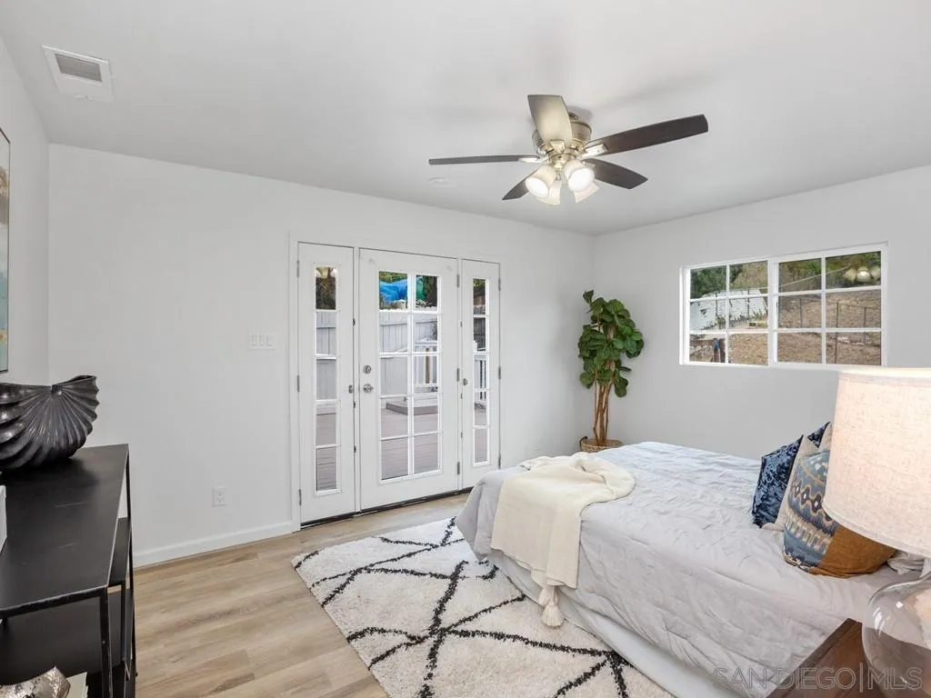 4765 Maple Avenue La Mesa, CA 91942 - Photo 16 of 26 a living room with furniture a window and wooden floor