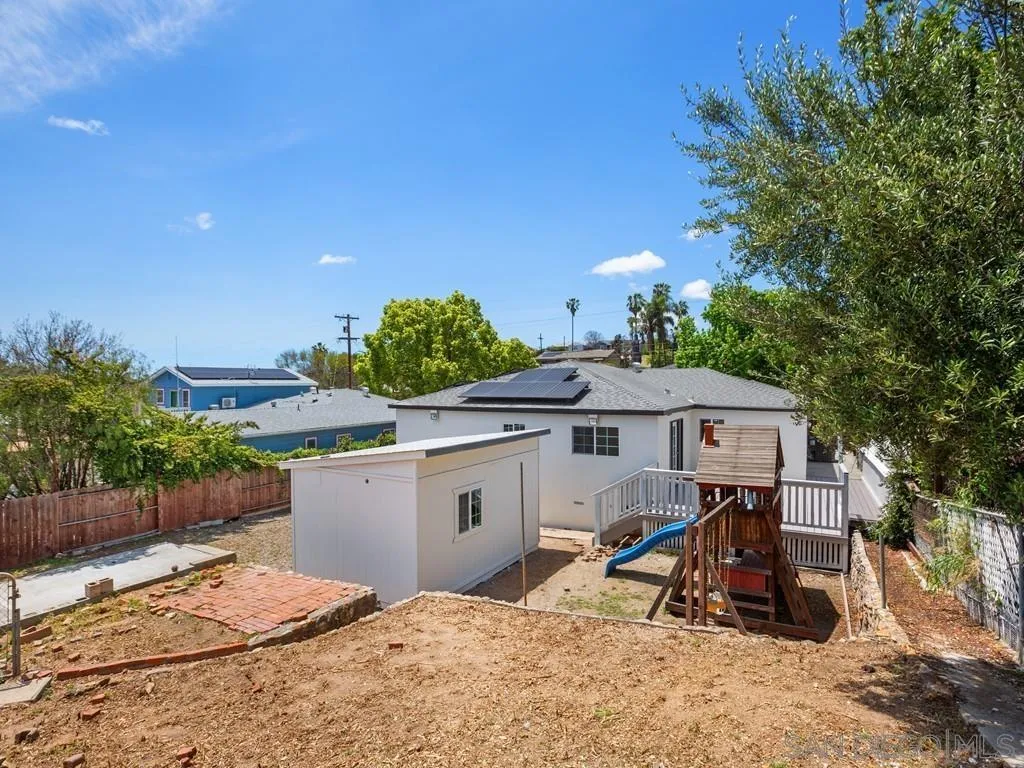 4765 Maple Avenue La Mesa, CA 91942 - Photo 19 of 26 a view of a terrace with a table and chairs under an umbrella