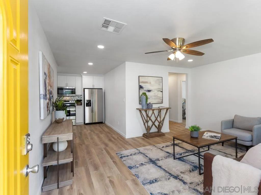 4765 Maple Avenue La Mesa, CA 91942 - Photo 2 of 26 a living room with furniture and kitchen view