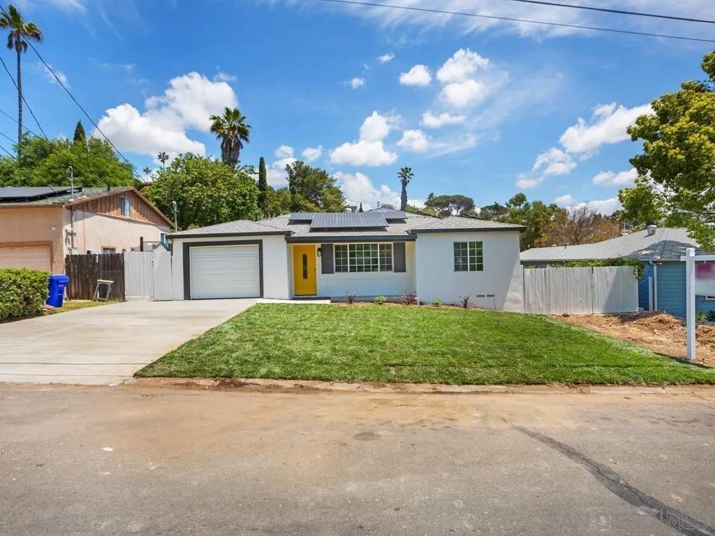 4765 Maple Avenue La Mesa, CA 91942 - Photo 25 of 26 a view of a house with a backyard and a garage