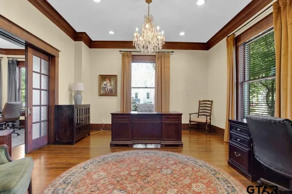 a view of a livingroom with furniture window and wooden floor