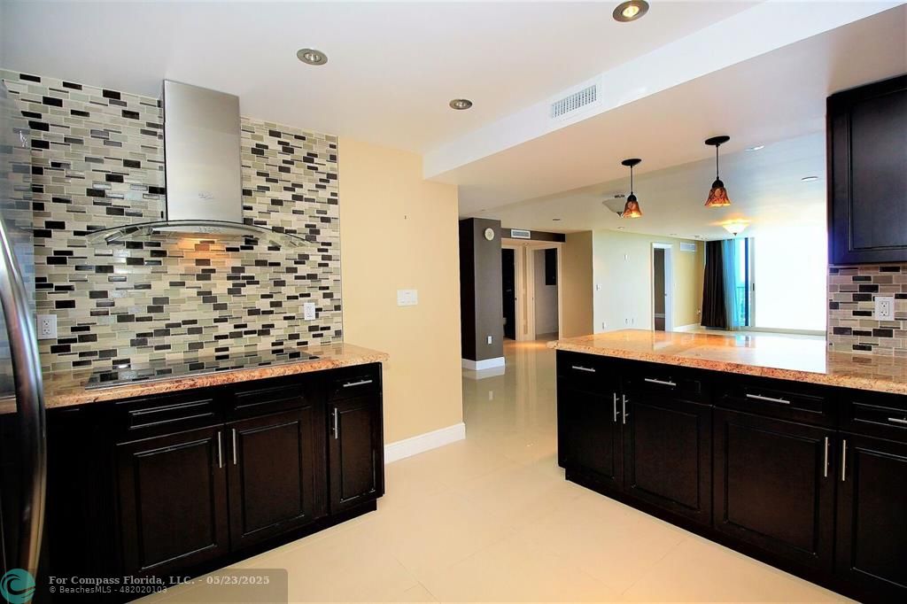 1360 South Ocean Boulevard, Unit 2806 Pompano Beach, FL 33062 - Photo 12 of 37 a kitchen with a sink and cabinets