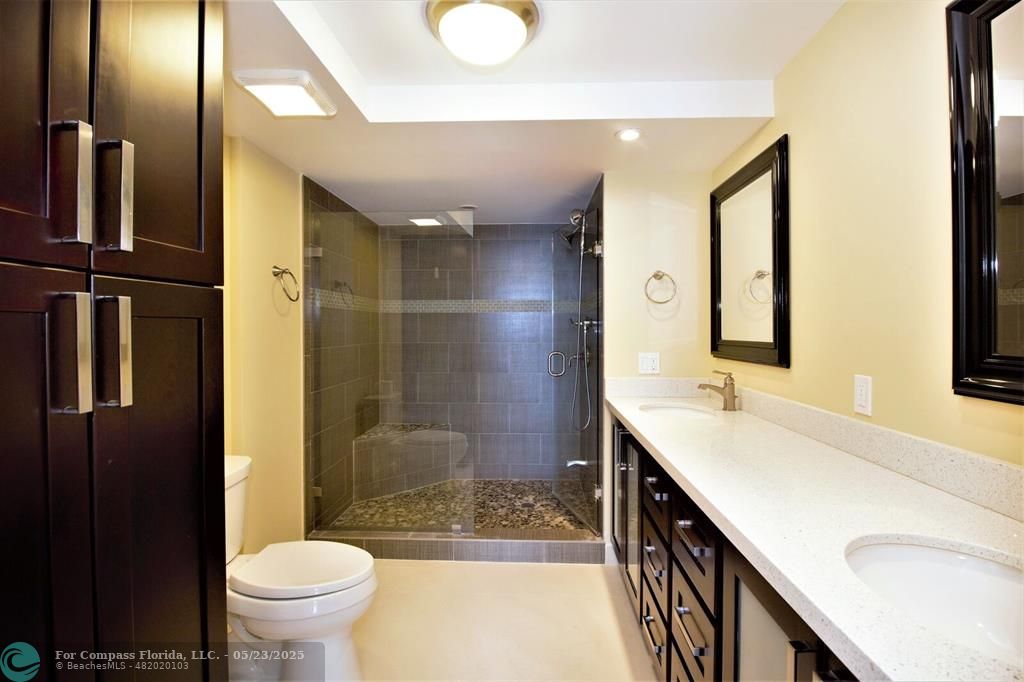 1360 South Ocean Boulevard, Unit 2806 Pompano Beach, FL 33062 - Photo 20 of 37 a bathroom with a sink a toilet and shower