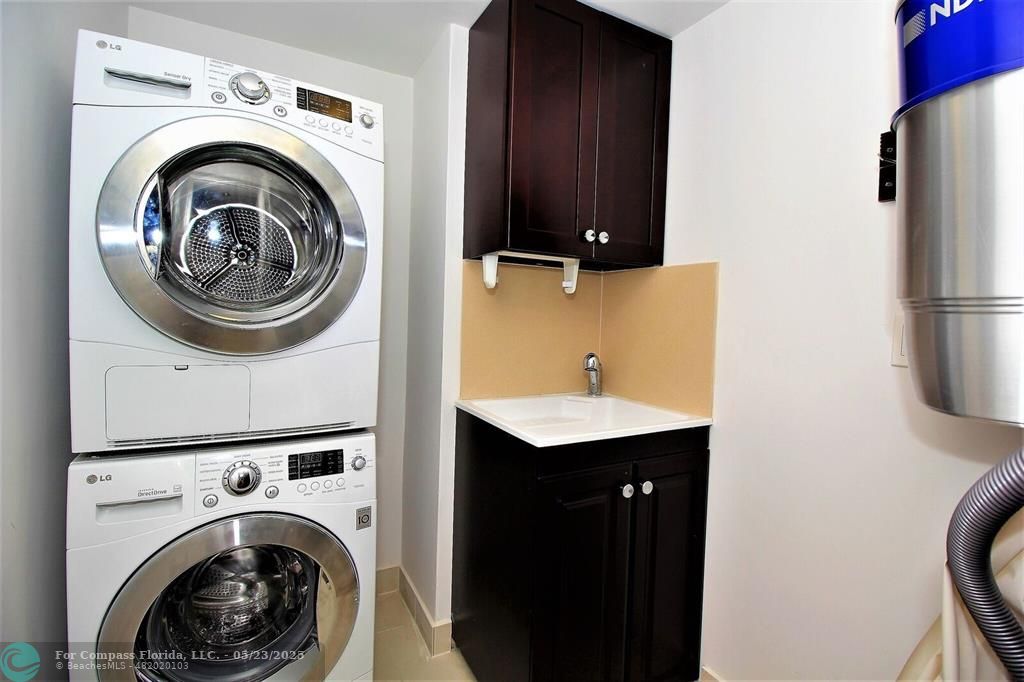 1360 South Ocean Boulevard, Unit 2806 Pompano Beach, FL 33062 - Photo 23 of 37 a utility room with sink dryer and washer