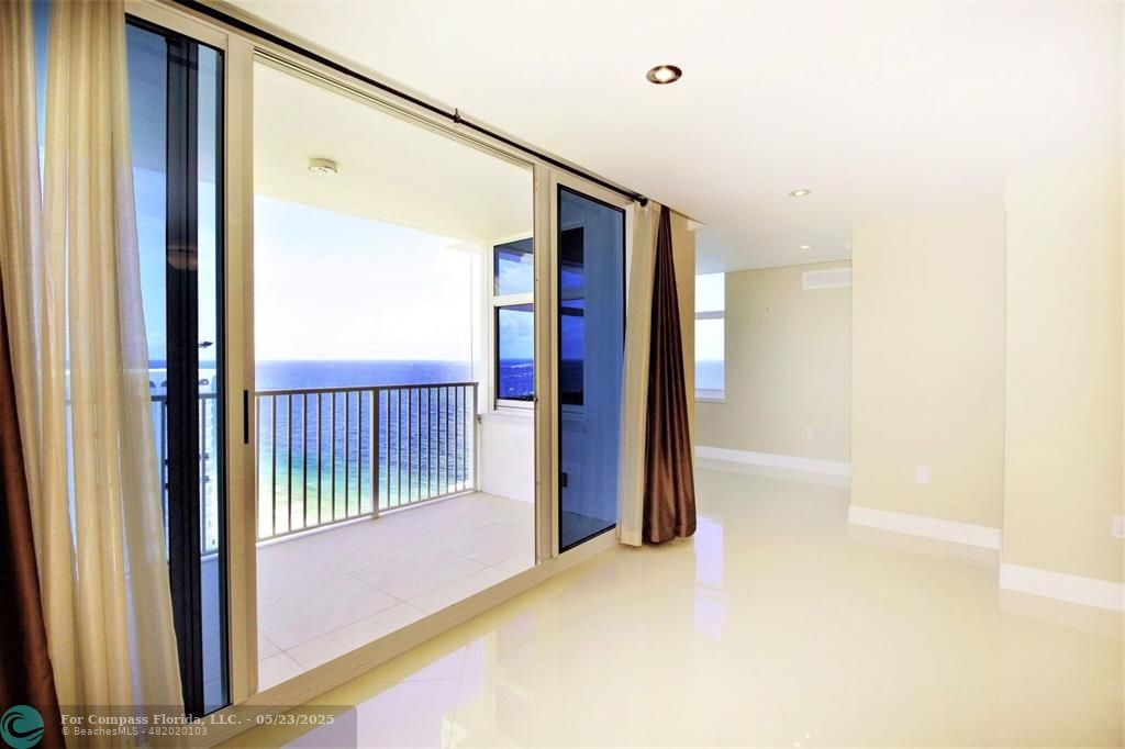 1360 South Ocean Boulevard, Unit 2806 Pompano Beach, FL 33062 - Photo 5 of 37 a view of a hallway with a large window