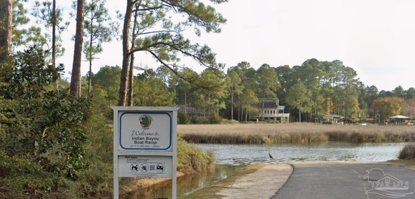 5599 Del Rey Street Milton, FL 32583 - Photo 13 of 25 a view of a house with a yard