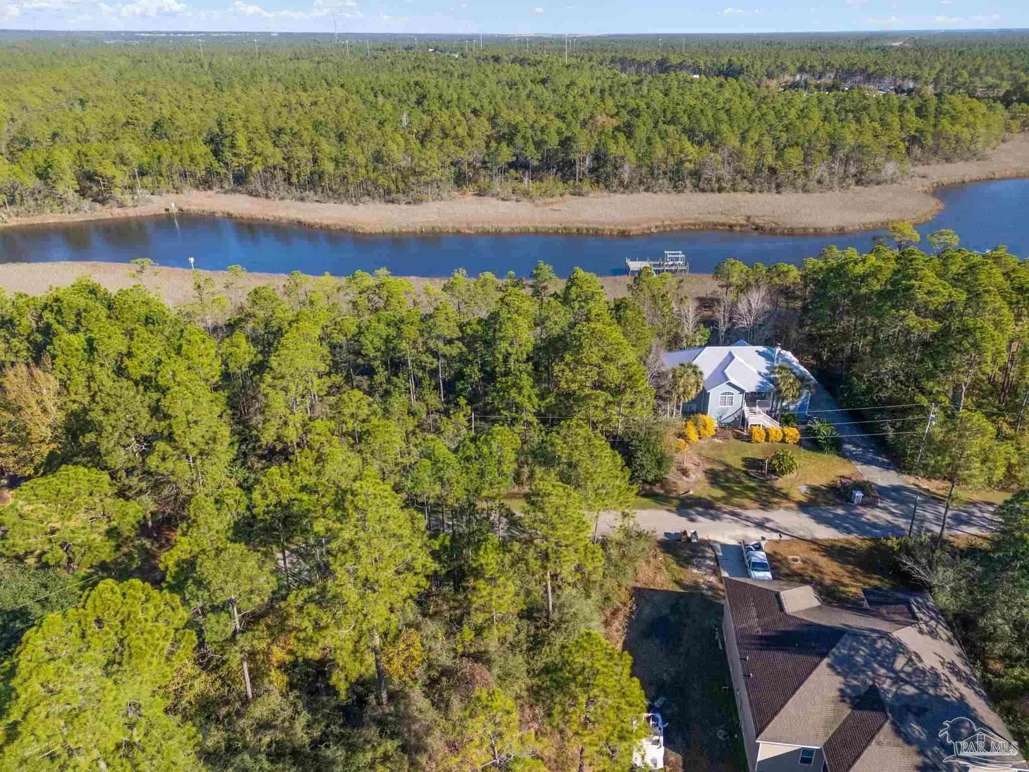 5599 Del Rey Street Milton, FL 32583 - Photo 2 of 25 a view of a yard with an outdoor seating