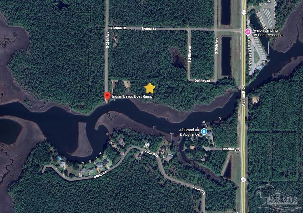 5599 Del Rey Street Milton, FL 32583 - Photo 21 of 25 a view of a house with a yard and potted plants