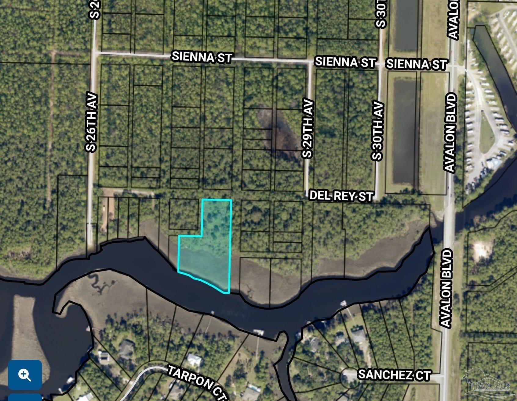 5599 Del Rey Street Milton, FL 32583 - Photo 24 of 25 a wooden bench sitting in front of a building