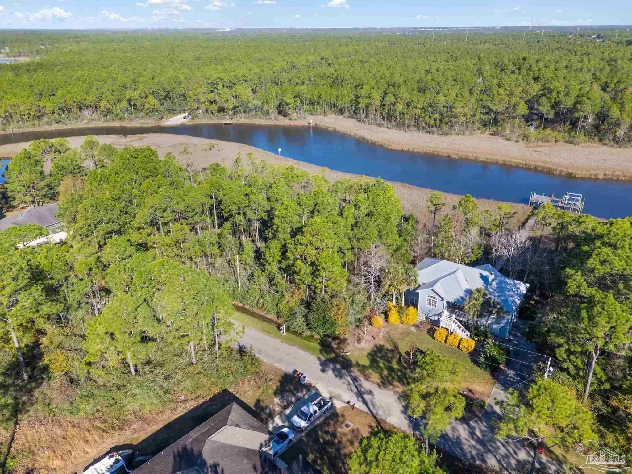 5599 Del Rey Street Milton, FL 32583 - Photo 10 of 25 a view of a yard with an ocean view