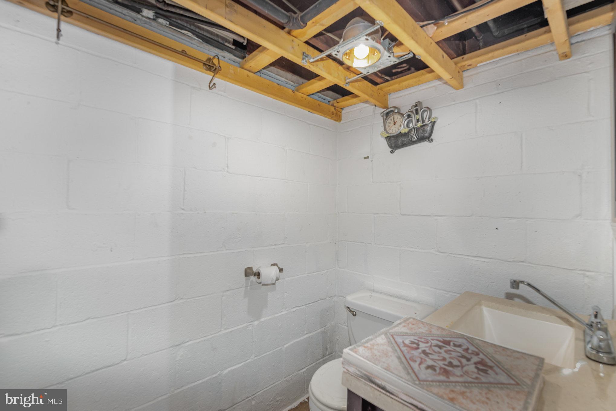1113 Orems Road Middle River, MD 21220 - Photo 32 of 38 a bathroom with a sink a toilet and bathtub