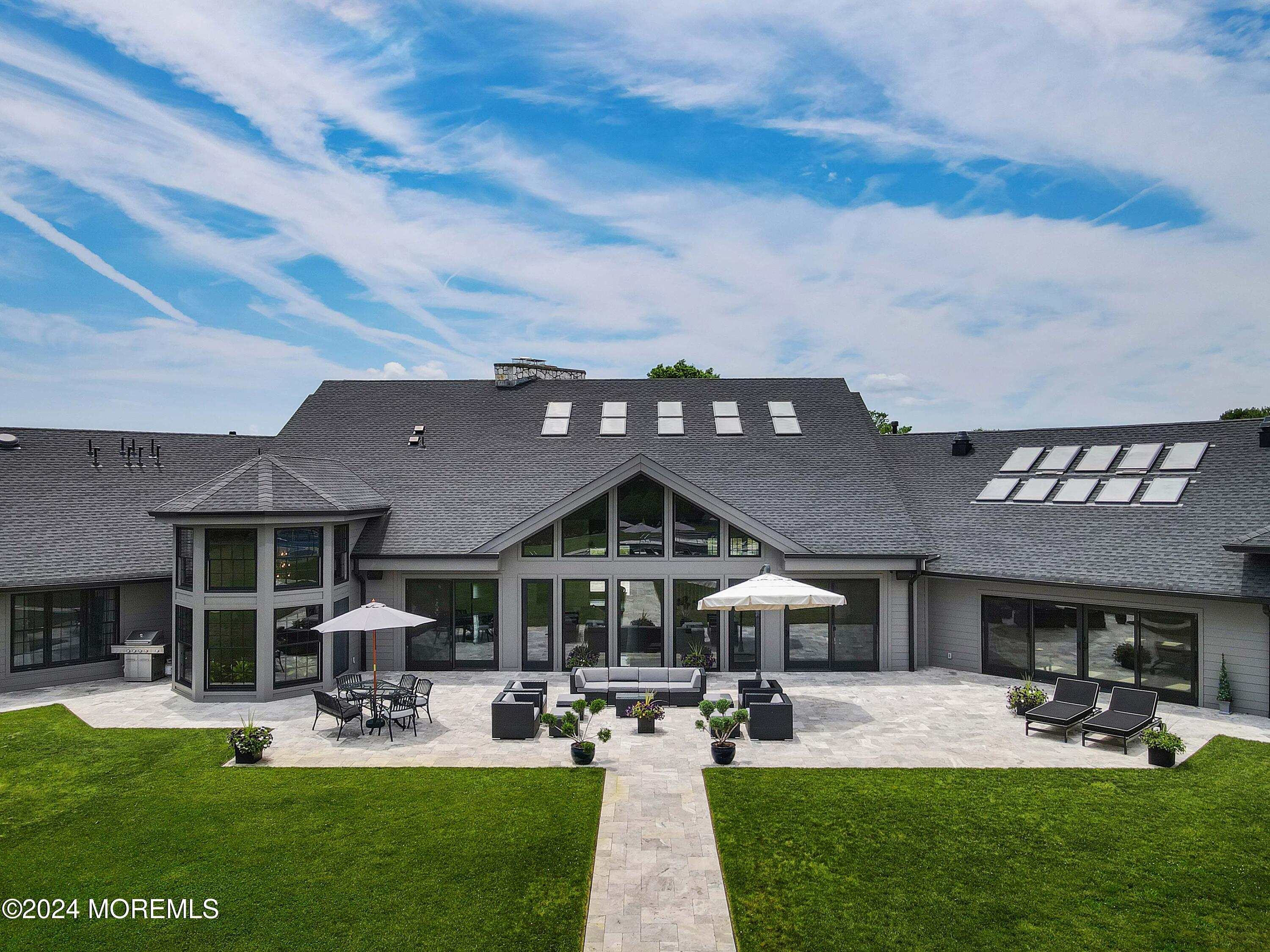 1980 Campbell Road Wall, NJ 07719 - Photo 103 of 110 a front view of a house with garden and sitting area