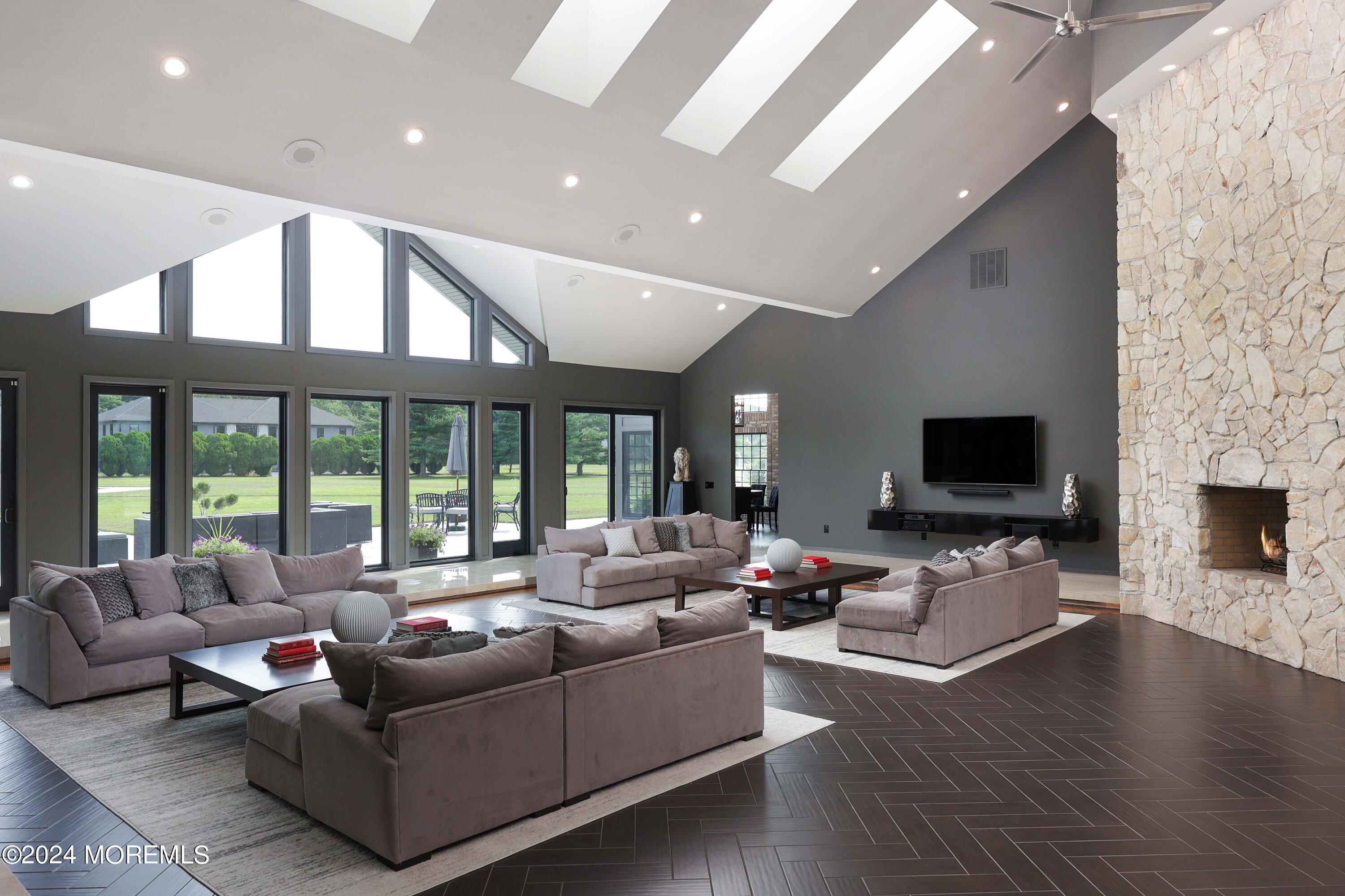 1980 Campbell Road Wall, NJ 07719 - Photo 14 of 110 a living room with fireplace furniture and a flat screen tv