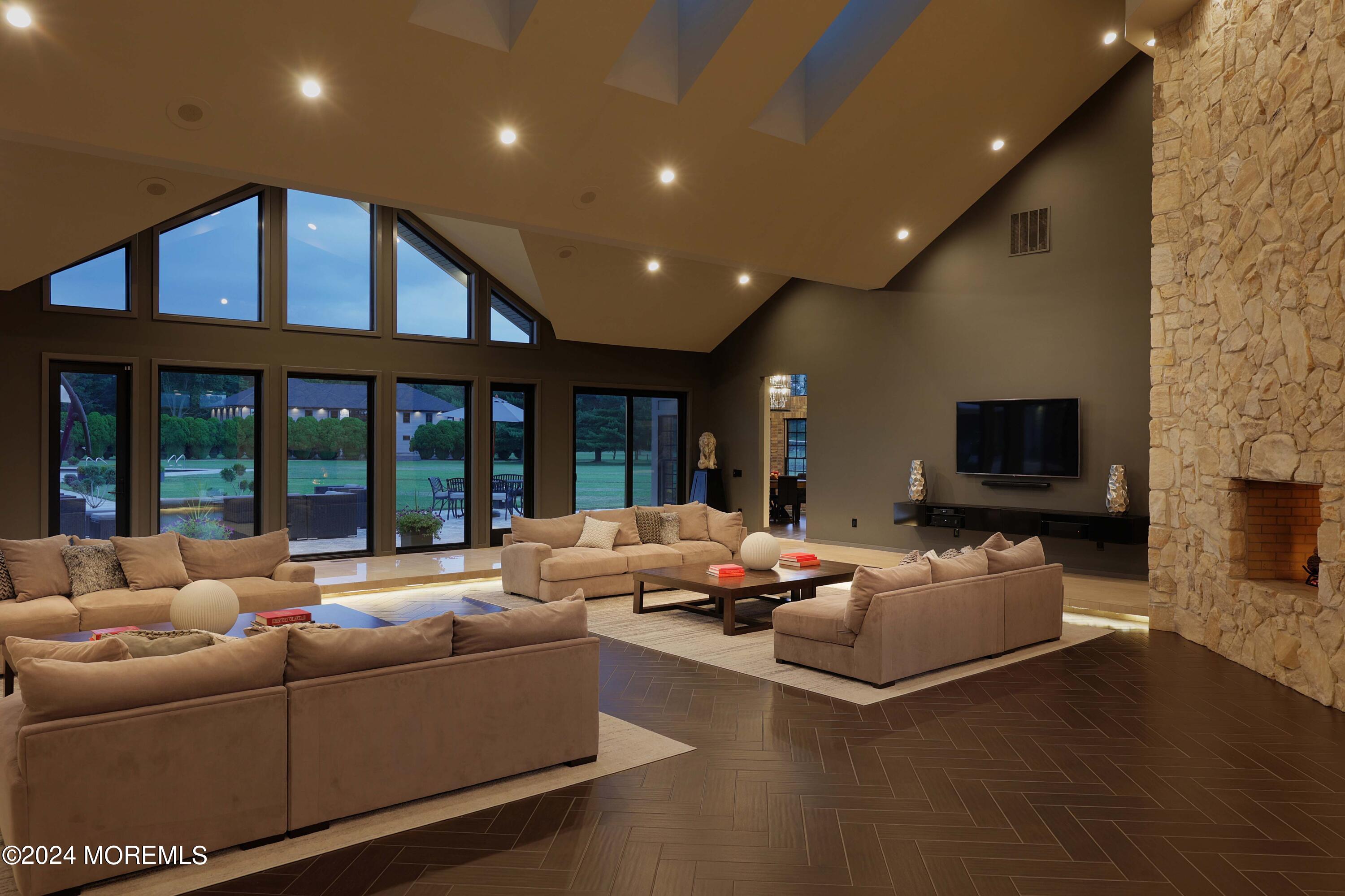 1980 Campbell Road Wall, NJ 07719 - Photo 16 of 110 a living room with furniture and a flat screen tv