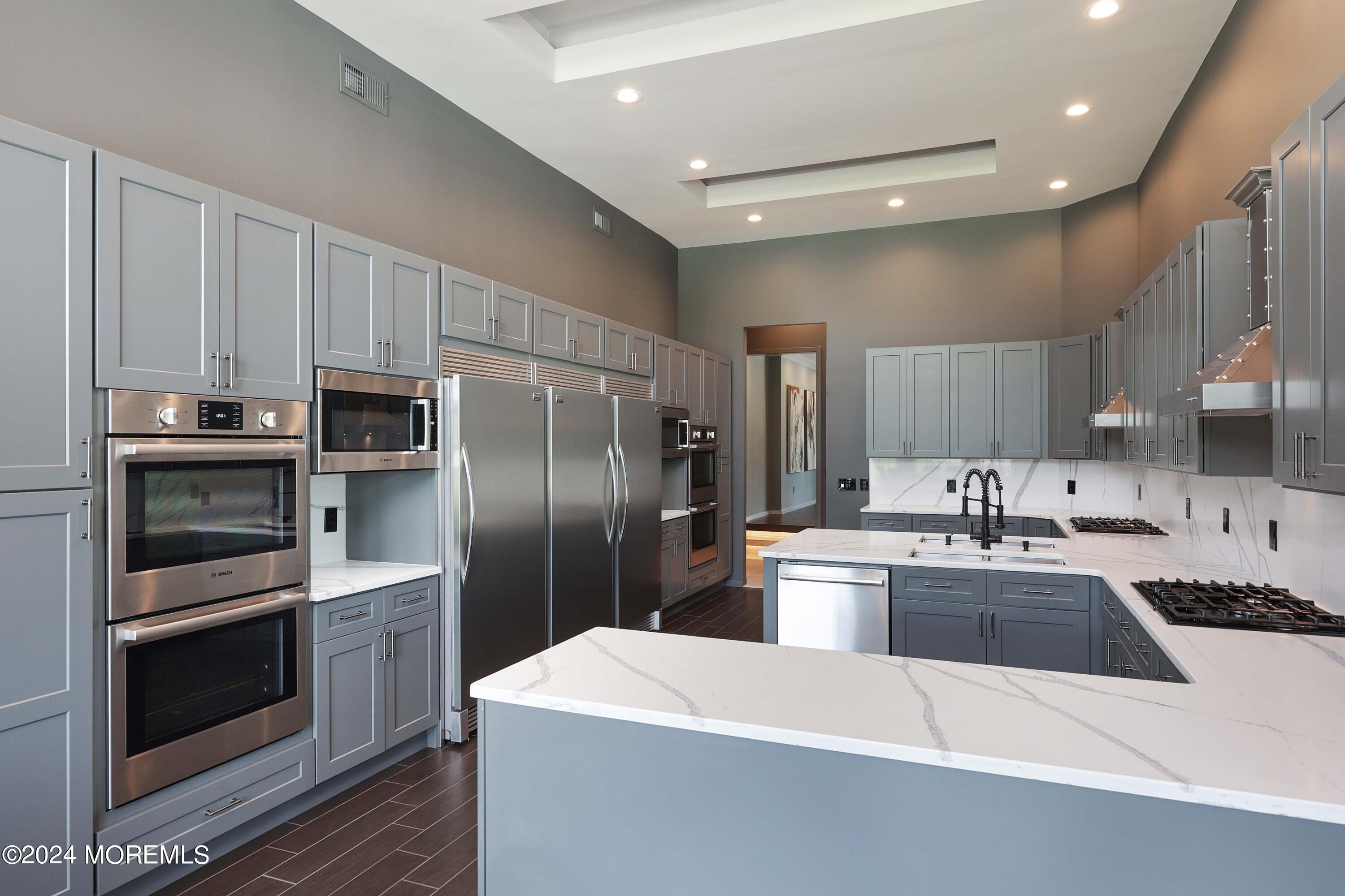 1980 Campbell Road Wall, NJ 07719 - Photo 33 of 110 a kitchen with stainless steel appliances a refrigerator sink and stove