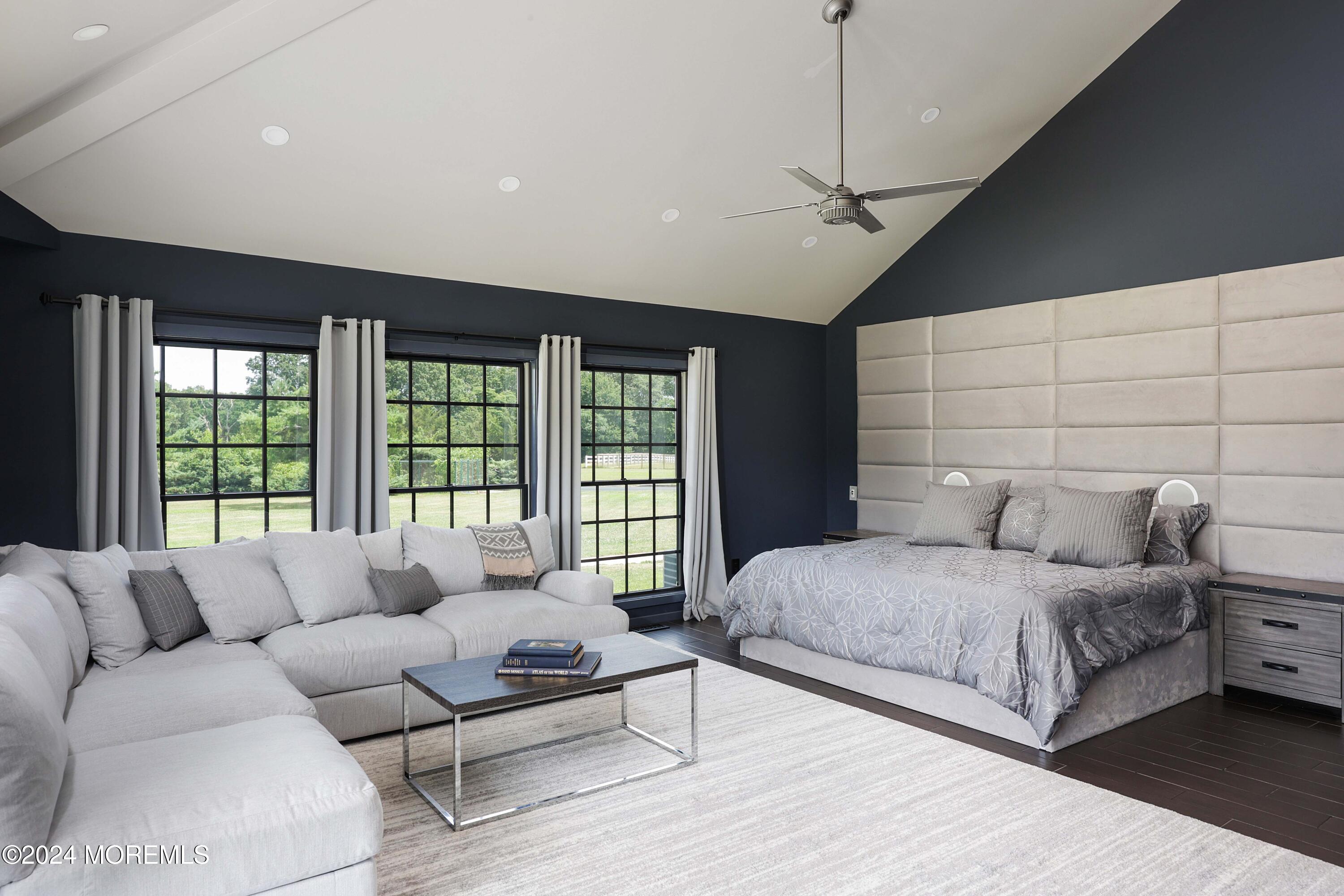 1980 Campbell Road Wall, NJ 07719 - Photo 42 of 110 a spacious bedroom with a large bed and a couch