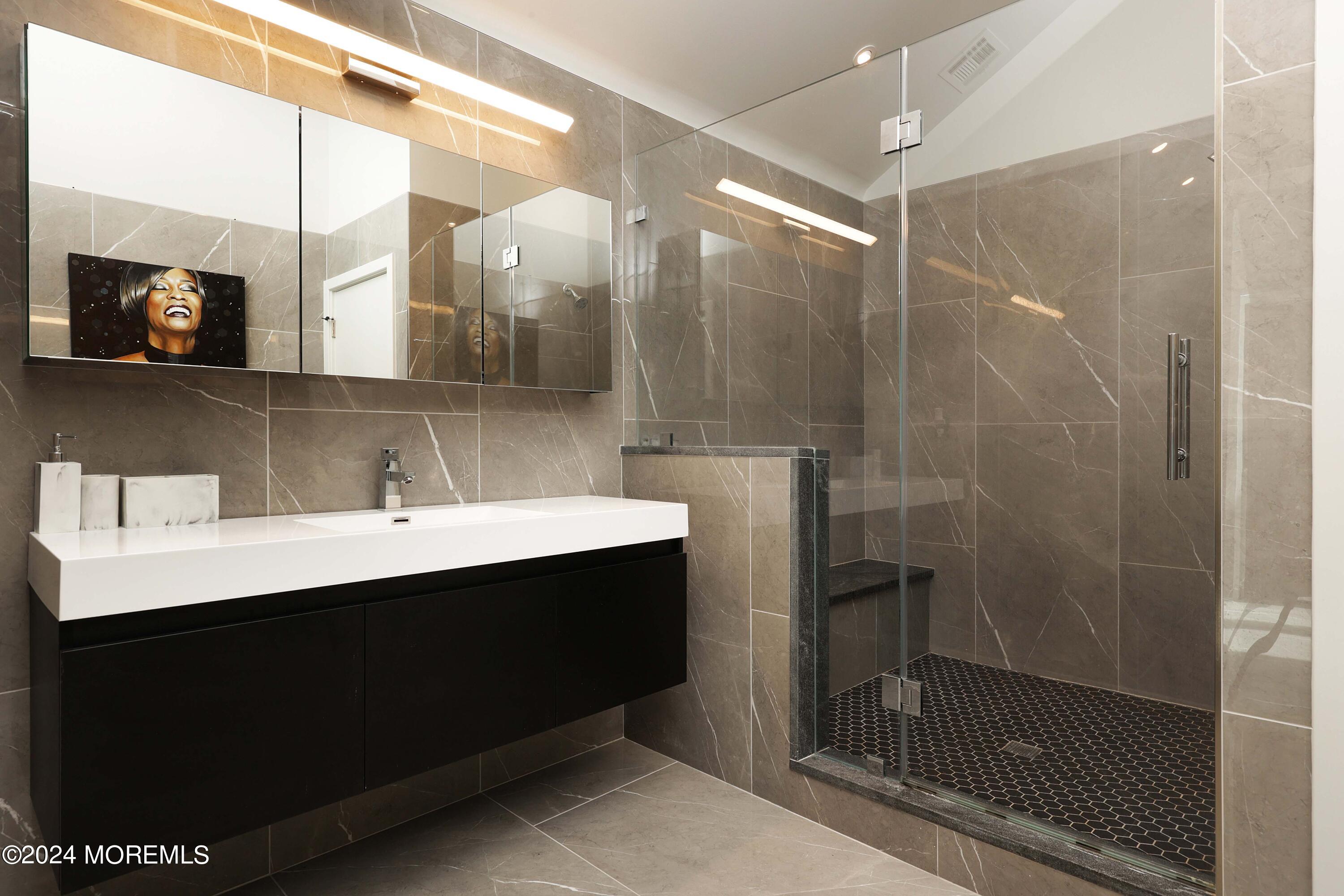 1980 Campbell Road Wall, NJ 07719 - Photo 47 of 110 a bathroom with a sink and a mirror